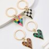 Wholesale Amazon checkered alloy heart personalized devil's eye keychain