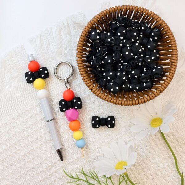 O1CN01LwHWhy2FO3hB8Zwhj_2216349148869-0-cib Wholesale 10pcs 3D Black Dot Red Dot Bow New Three-dimensional Silicone Cute Cartoon DYI Beads
