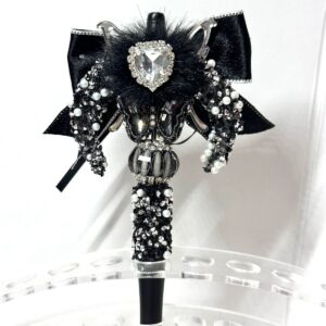 A finished black butterfly knot pen