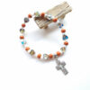 O1CN01NyIiNm1RxZipgfBJ9_2220646552178-0-cib Wholesale Colorful ceramic hollowed-out cross elastic bracelet