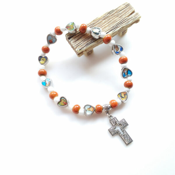 O1CN01NyIiNm1RxZipgfBJ9_2220646552178-0-cib Wholesale Colorful ceramic hollowed-out cross elastic bracelet