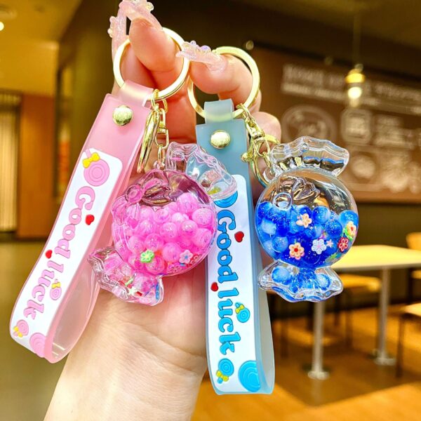 Wholesale Oil filled luminous colorful candy quicksand bottle keychain