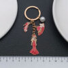 Wholesale Cross-border oil drop red alloy princess dress model hat high heels pearl keychain niche jewelry pendant