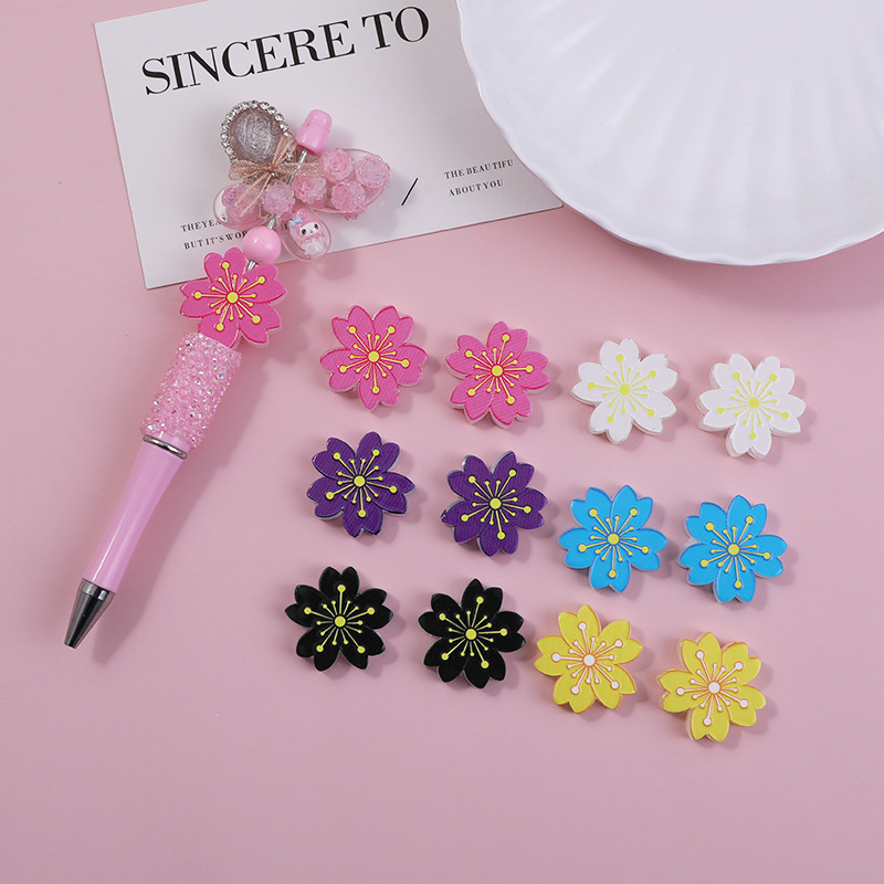 Wholesale Through-hole double-sided embossed cartoon cherry blossom beads