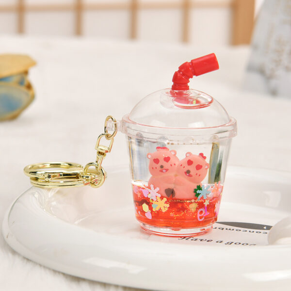 Wholesale Oil-filled acrylic doll cylindrical cup with flowing sand bottle keychain