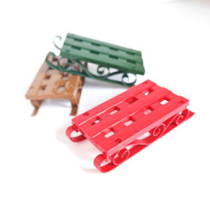 Pack of three snowboards red, green and brown