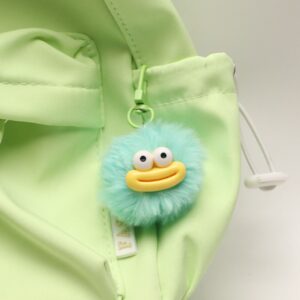 Green fur ball sausage mouth