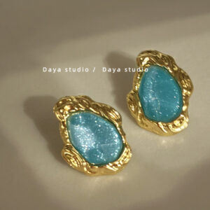 A pair of blue silver needles