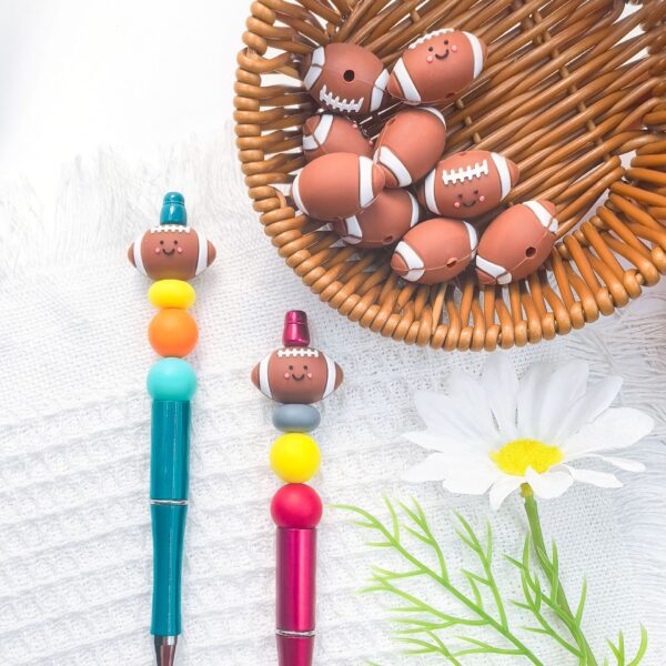 O1CN01RQUYB42FO3hPJrRlB_2216349148869-0-cib Wholesale 10pcs 3D Three-dimensional Silicone Cute Cartoon Rugby DIY Beads