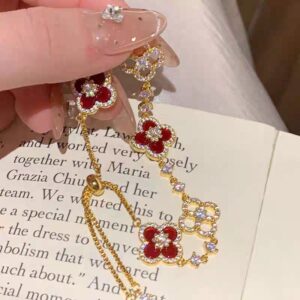 Gold bracelet with red shells