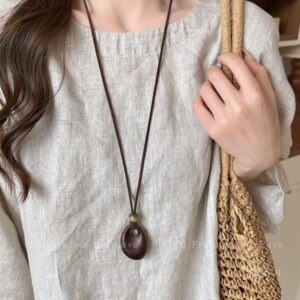Brown hollow irregular small oval long necklace