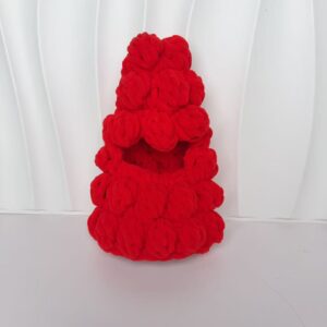 White embryo with red Christmas tree headgear