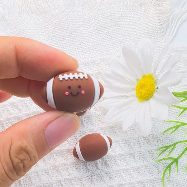 O1CN01TqMS2S2FO3hSUPz7M_2216349148869-0-cib Wholesale 10pcs 3D Three-dimensional Silicone Cute Cartoon Rugby DIY Beads