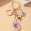 Wholesale Seaside vacation luminous conch metal keychain