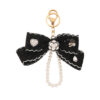Wholesale Black and white color Chanel style camellia pearl chain bow keychain