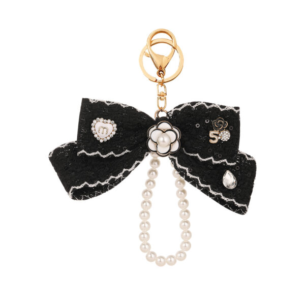 Wholesale Black and white color Chanel style camellia pearl chain bow keychain