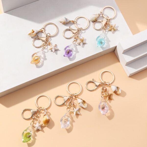 Wholesale Seaside vacation luminous conch metal keychain