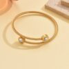 O1CN01UKpi6Q1MqBCfGpu5d_2212889381485-0-cib Wholesale Stainless steel artificial zircon silver open bangle with a twisted design