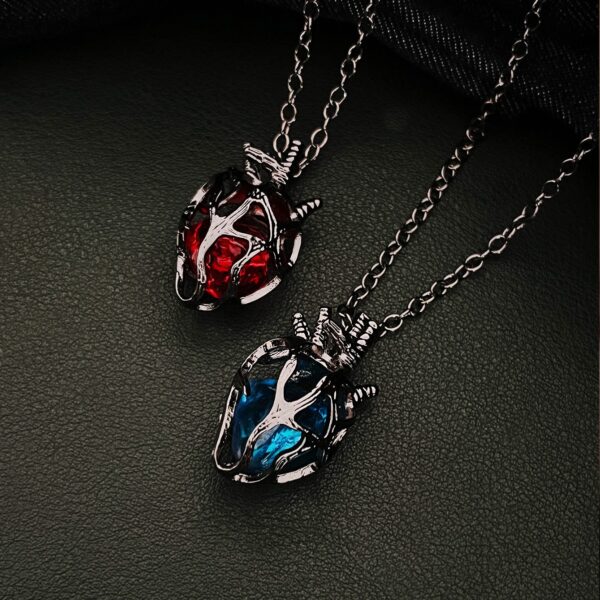 O1CN01V6L6hG1l7d8YdyB7S_2216037694772-0-cib Wholesale Gothic dark style hollow heart red blue glass heart pendant necklace