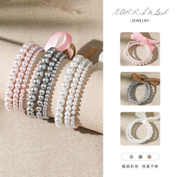 O1CN01VdjzS41ZBV0kuVsgU_2925713156-0-cib Wholesale Bow colored pearl multi-layer layered bracelet