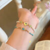 Wholesale Turquoise bead layered metal flower bracelet