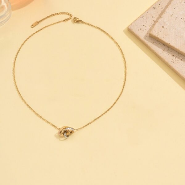 Wholesale Stainless steel gold double-ring linked artificial zircon necklace, bracelet, and earrings