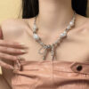 Wholesale Sparkling pearl bow tassel necklace