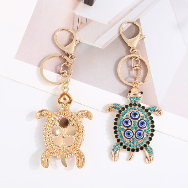 Wholesale Turtle shell with devil's eye inlaid with rhinestones Metal Keychain