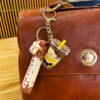 Wholesale Milk tea bear quicksand keychain exquisite cute schoolbag pendant