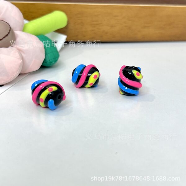 O1CN01ZOhVZY1g1ba1kUPrH_2215525424082-0-cib Wholesale Black barrel bead, glassy rainbow striped beads