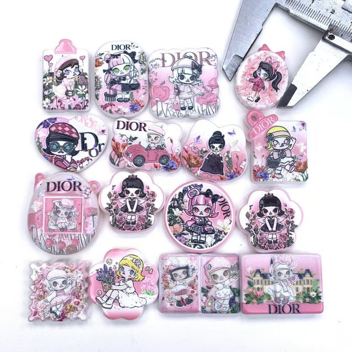 Wholesale New style double-sided embossed printed beaded bag charms and aessories.