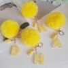 Wholesale Yellow letter ball pendant flower shaped letter keychain
