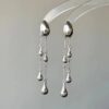 O1CN01b72klE26dmlQOyAVi_2209765657685-0-cib Wholesale Alloy Silver Teardrop Tassel Earrings