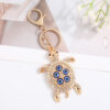 Wholesale Turtle shell with devil's eye inlaid with rhinestones Metal Keychain