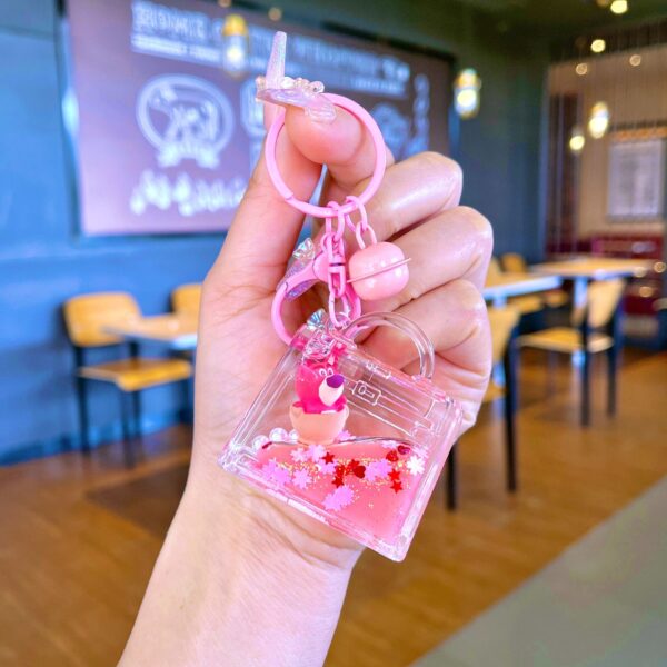 Wholesale Oil filled pink strawberry bear quicksand keychain