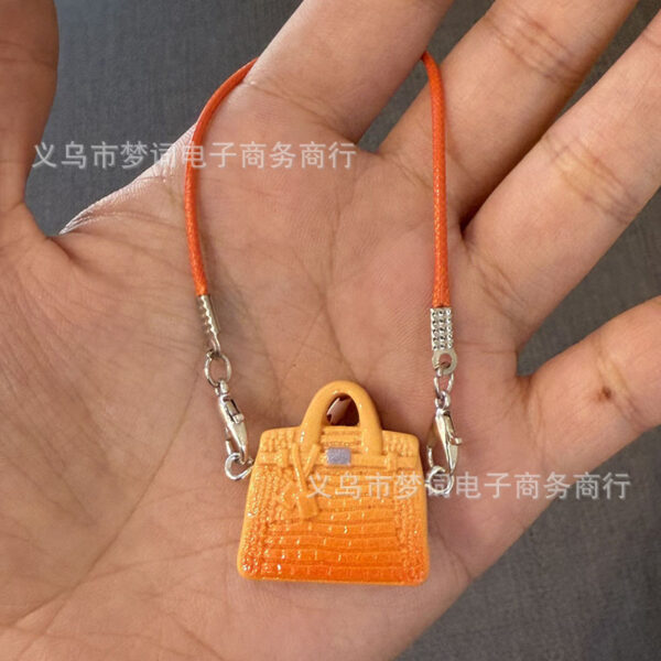 O1CN01cSnMiU29F0HJZnM7Y_2216239028037-0-cib Wholesale Miniature doll keychain bag charm resin accessory OLY Exclusive