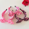 Wholesale Valentine's Day headband with bow, bunny ears, and a pink heart shape