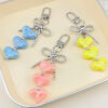 Wholesale Macaron-colored heart metal bow keychain