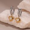 Wholesale Heart-shaped diamond-encrusted stainless steel earrings with plating