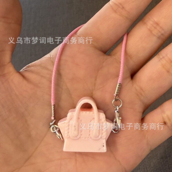 O1CN01fTXtGp29F0HLjJPwd_2216239028037-0-cib Wholesale Miniature doll keychain bag charm resin accessory OLY Exclusive