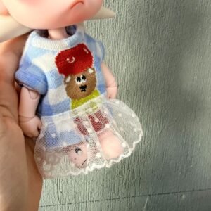 Blue plaid dress / No Velcro, pull it out or thread it from the bottom up.