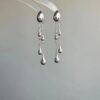 O1CN01hsDeQS26dmlO0q1fI_2209765657685-0-cib Wholesale Alloy Silver Teardrop Tassel Earrings