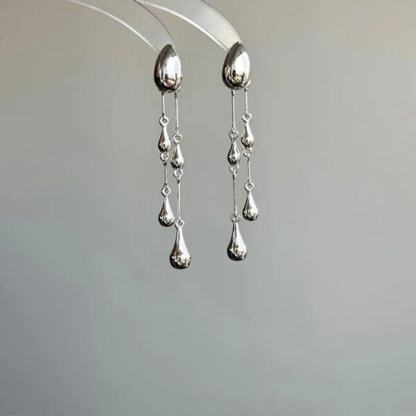 O1CN01hsDeQS26dmlO0q1fI_2209765657685-0-cib Wholesale Alloy Silver Teardrop Tassel Earrings