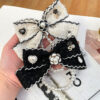 Wholesale Black and white color Chanel style camellia pearl chain bow keychain