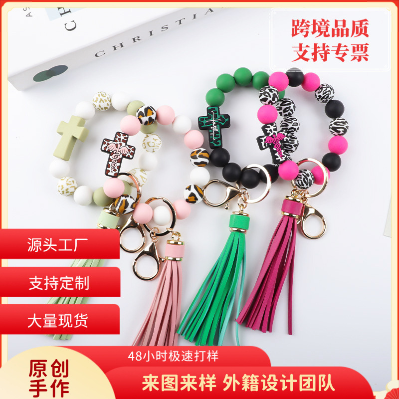 Wholesale Colored bead cross silicone bead tassel keychain