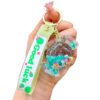 Wholesale Oil filled luminous colorful candy quicksand bottle keychain