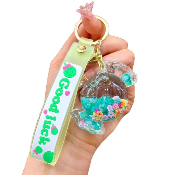 Wholesale Oil filled luminous colorful candy quicksand bottle keychain