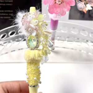 A finished yellow lily of the valley beaded pen