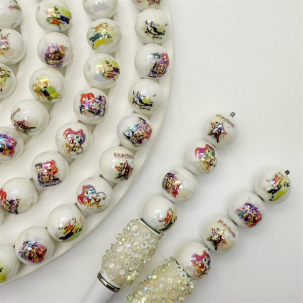 O1CN01isJk2L1HgUn6DO99r_2216860830787-0-cib Wholesale Acrylic printed cartoon witch hunter gro straight hole round beads DIY TikTok live streaming beaded mobile phone rope jewelry aessories
