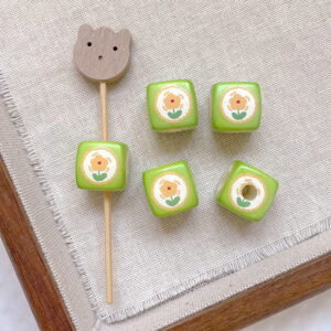 1 # Five-petal flower on green background (one)